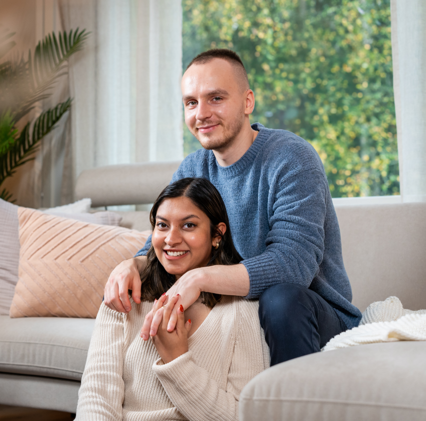 couple of expats sitting on a sofa